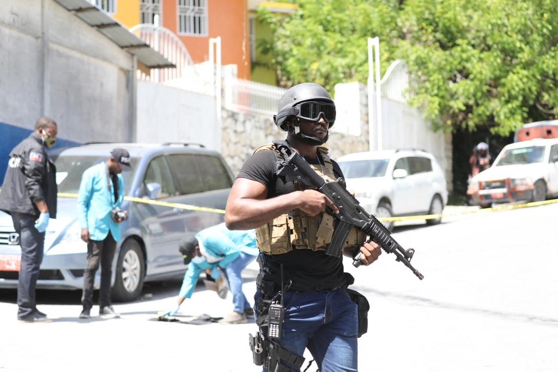 Members of the Haitian police and forensics looked for evidence outside of the presidential residence on July 7, 2021, in Port-au-Prince after the assassination of President Jovenel Moïse.