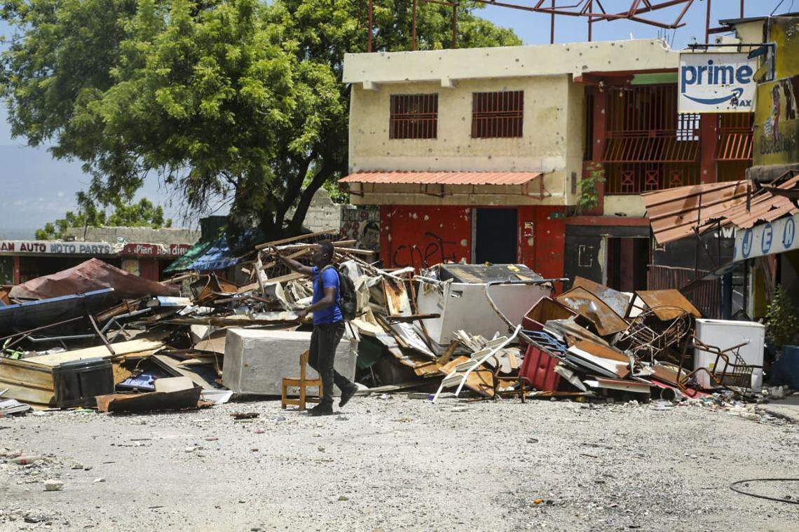 Residents of the Delmas neighborhood, who were forced to flee their homes by armed gangs, tour the destruction on Thursday, Aug. 28, 2025 after spokesman for the Viv Ansanm gang coalition, Jimmy “Barbecue” Chérizier invited residents to return home.