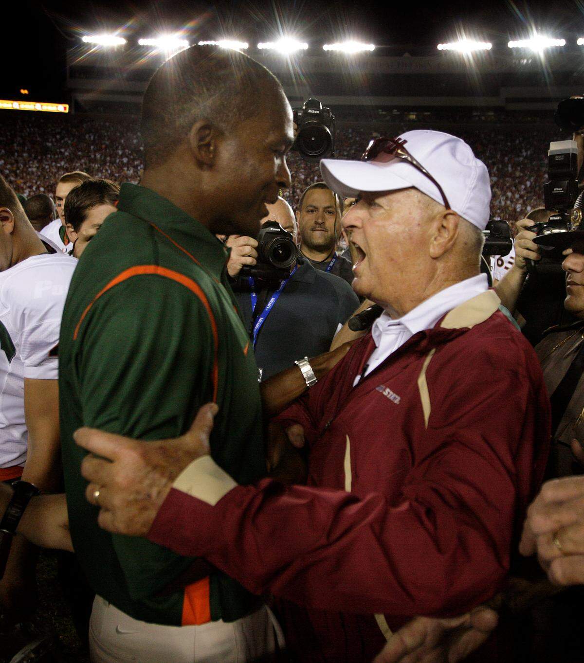 The University of Miami vs Florida State University at Bobby Bowden Field at Doak Campbell Stadium on the campus of Florida State University in Tallahassee, Florida on September 7, 2009. University of Miami coach Randy Shannon and Florida State University’s Coach Bobby Bowden meet after the game. UM won 38-34.