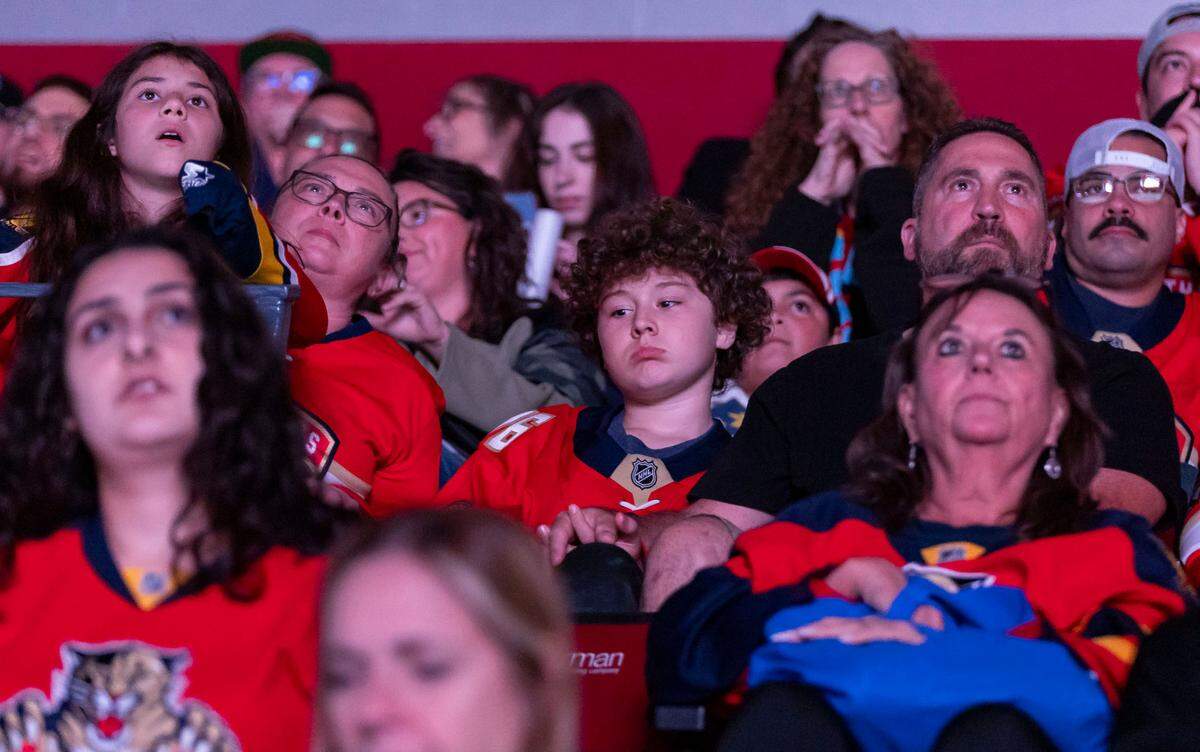 Sadness is reflected on the faces of Florida Panthers fans as they watch their team lose to the Edmonton Oilers in Game 4 of the NHL Stanley Cup Final.