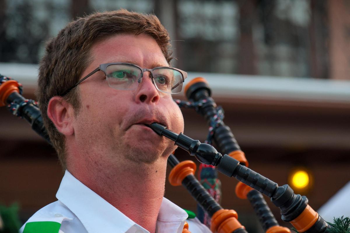 Jason Wright of the Saint Andrews Pipe Band of Miami plays the bagpipes during the John Martin’s 32nd Annual St. Patrick’s Day Street Festival in Coral Gables, Florida, Saturday, March 15, 2025.