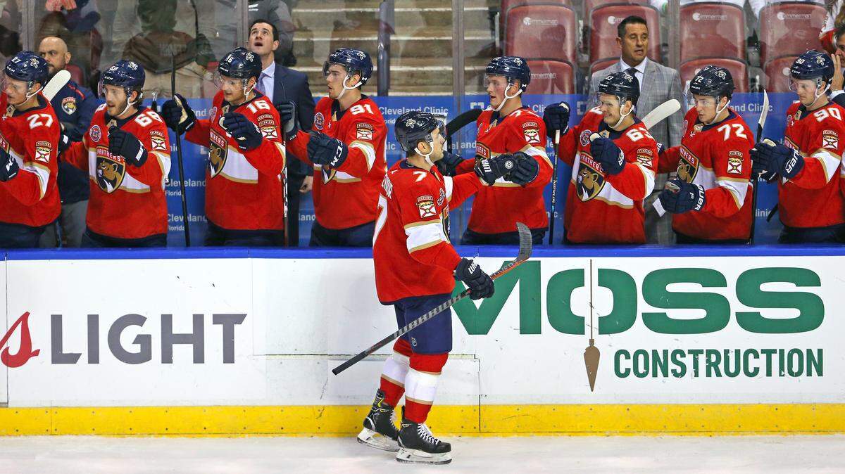 Florida Panthers center Colton Sceviour #7 celebrates with the bench after scoring against Colorado Avalanche goalie Philipp Grubauer #31 on December 6, 2018.