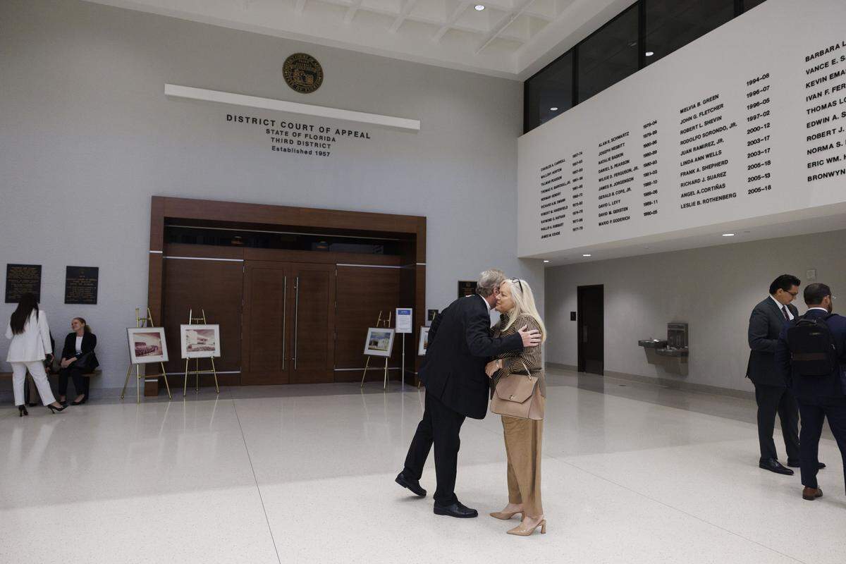 Alina Garcia, supervisor of elections for Miami-Dade County, right, arrives at the Third District Court of Appeal before the hearing for a case Emilio González brought against the city of Miami on Tuesday, July 29, 2025, in Miami.