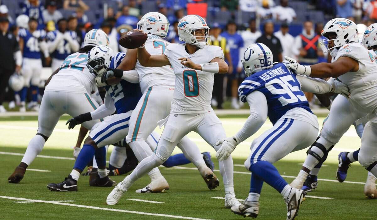 Miami Dolphins quarterback Zach Wilson (0) sets up to pass in the second half of an NFL game against the Indianapolis Colts at Lucas Oil Stadium in Indianapolis on Sunday, September 7, 2025.
