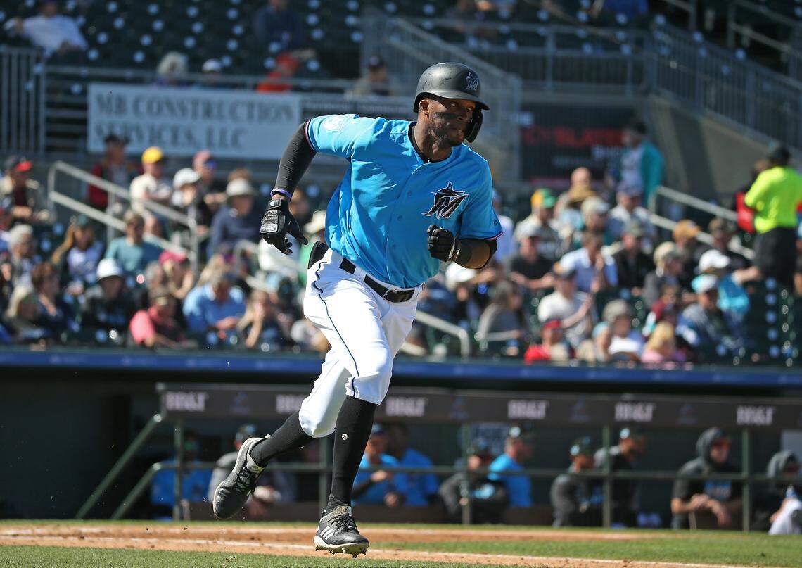 Miami Marlins designated hitter Rosell Herrera (5) runs to first base after hitting a single during the fifth inning of a Major League Baseball spring training game against the Atlanta Braves at the Roger Dean Chevrolet Stadium on Wednesday, March 6, 2019 in Jupiter, FL.