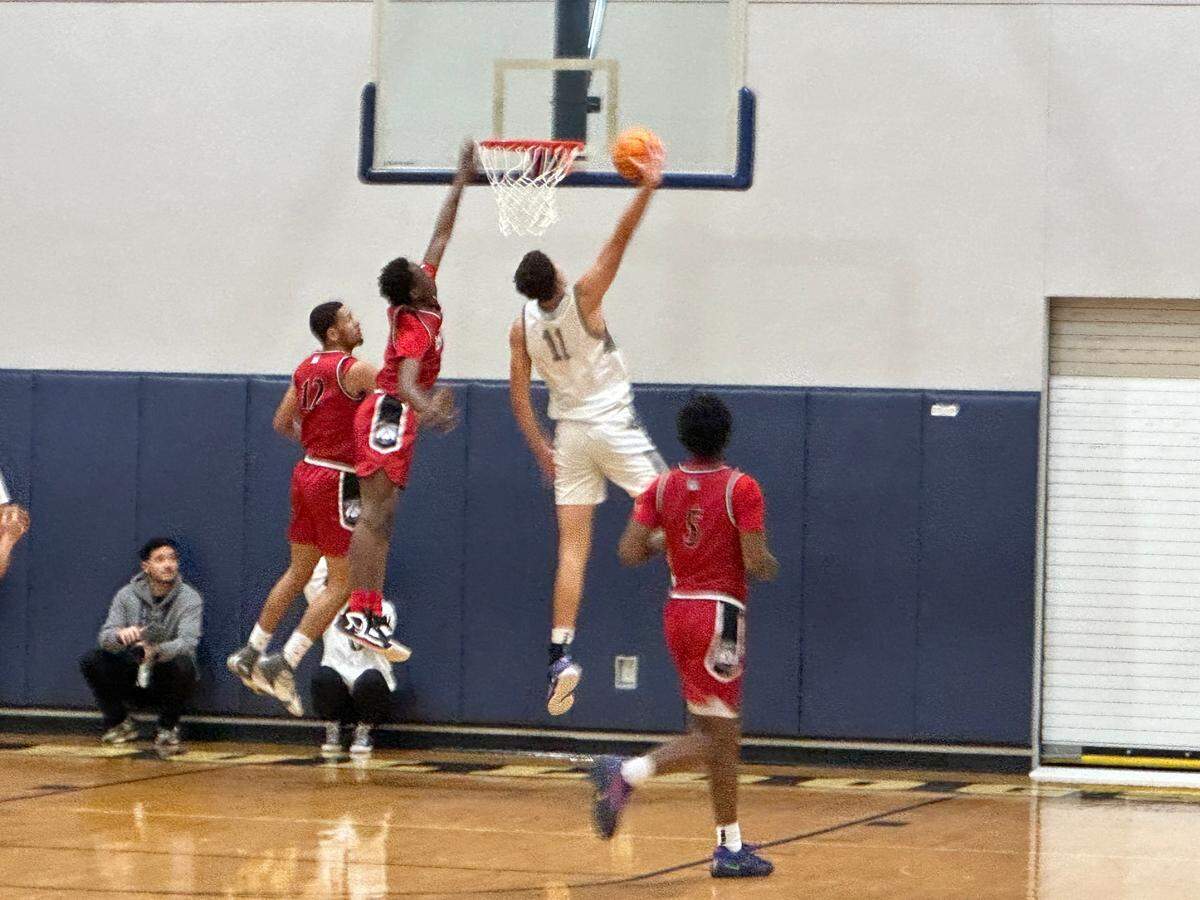 Riviera Prep center Gustavo Guimaraes Alves leaps to attempt a dunk during Tuesday’s Region 4-3A boys’ basketball semifinal against Hialeah Educational Academy.