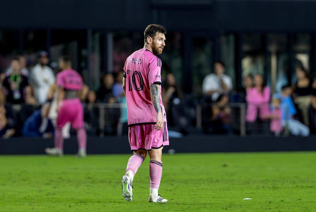 Inter Miami forward Lionel Messi (10) leaves the field as he watches Atlanta United celebrate their victory in the third game of their MLS playoff series at Chase Stadium on Saturday, Nov. 9, 2024, in Fort Lauderdale, Florida.