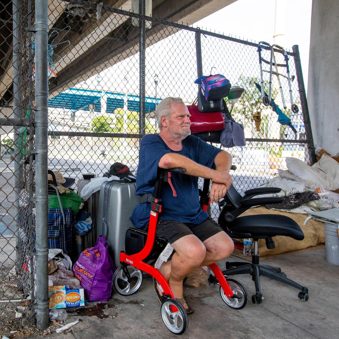 Jeffrey Snow, a former Booker T. Washington math teacher who lacks housing, sits underneath the I-95 expressway off Southwest 1st street and Southwest Second Avenue in Miami, Florida, on Monday, September 20, 2021.