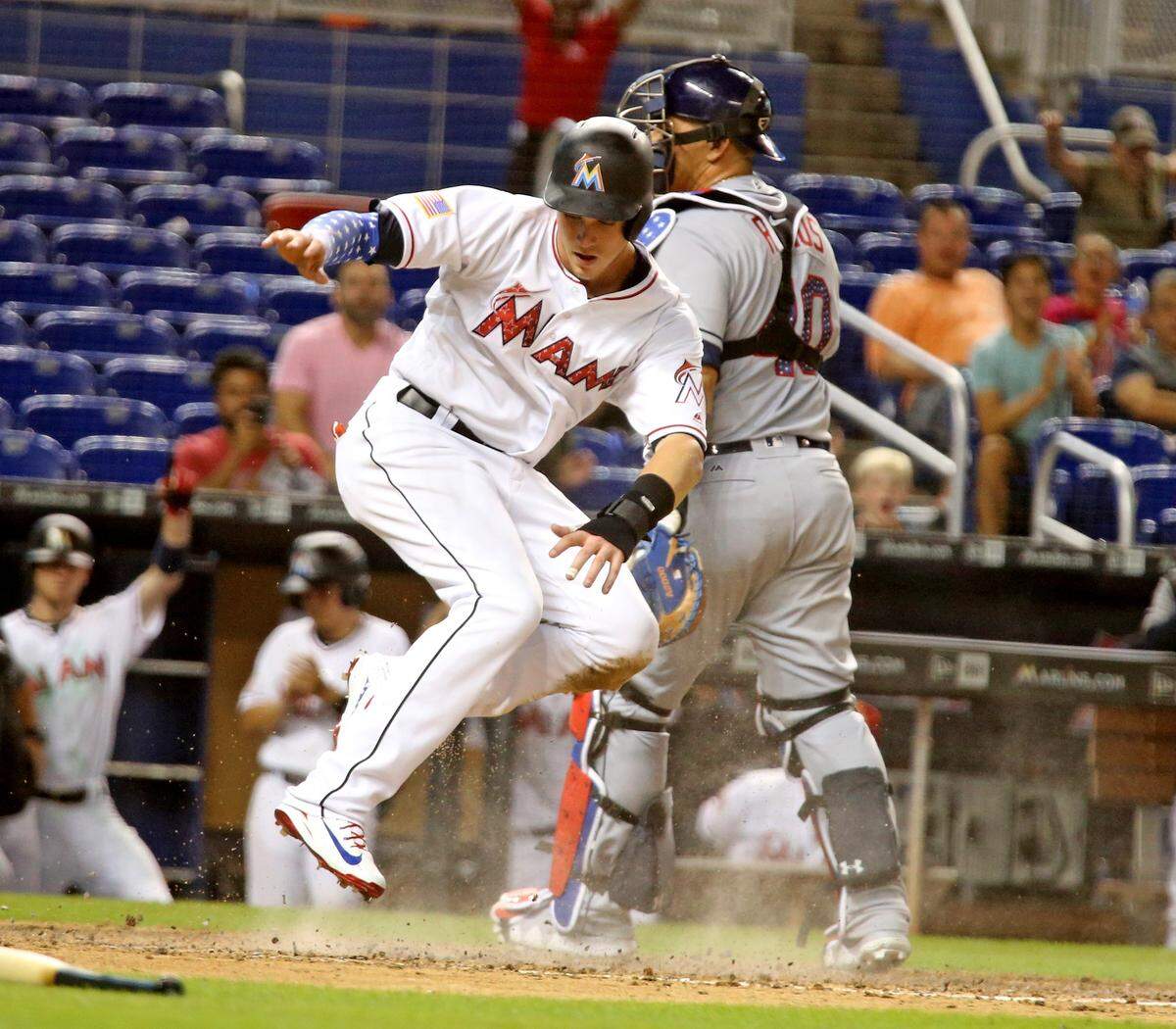 Miami Marlins Brian Anderson scores the winning run in the tenth inning as they defeat the Tampa Bay Rays at Marlins Park in Miami, Florida, July 2, 2018.