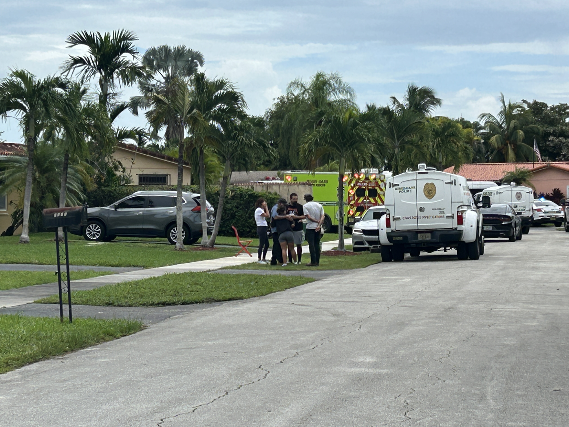 Loved ones of the two dead found inside a Kendall home could be seen asking authorities about the fire that raged through the house. They declined to speak with media.