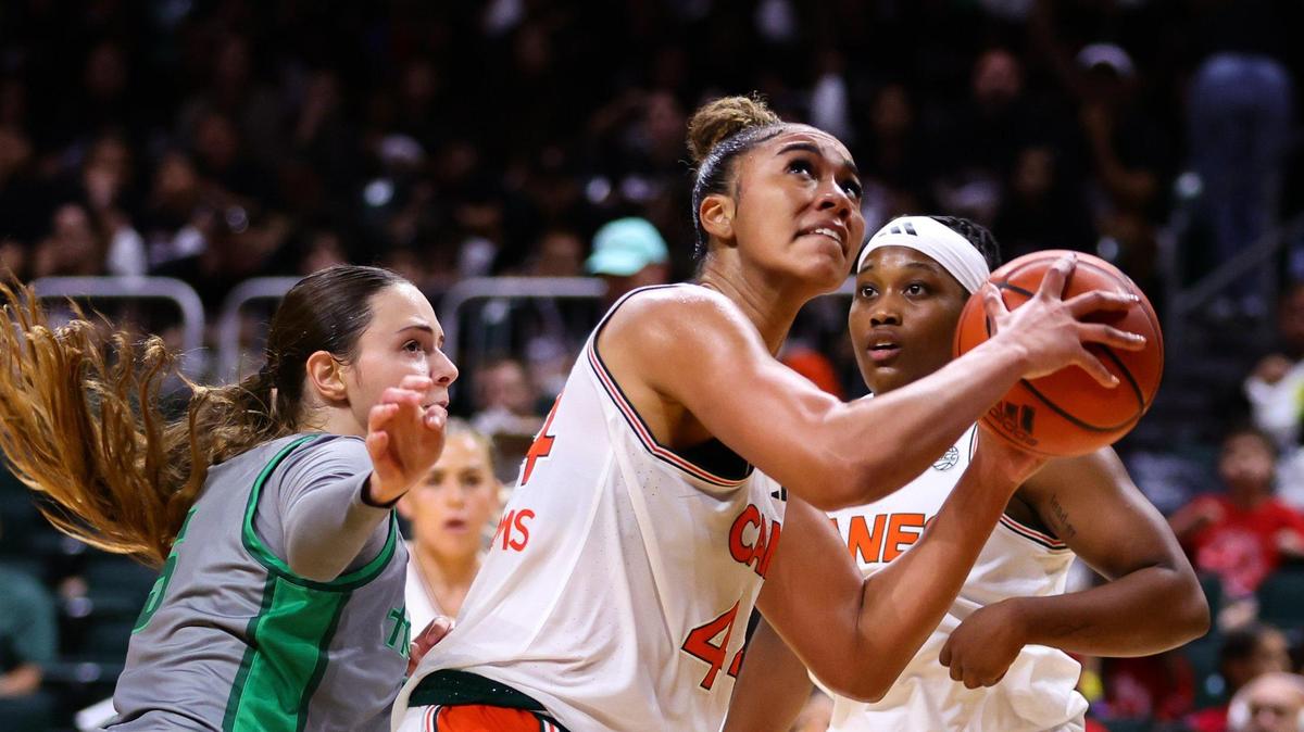 Miami Hurricanes forward Cameron Williams (44) drives to the basket against Stetson Hatters guard Noga Haran (5) during the second quarter at the Watsco Center in Coral Gables, Florida, Monday, November 4, 2024.