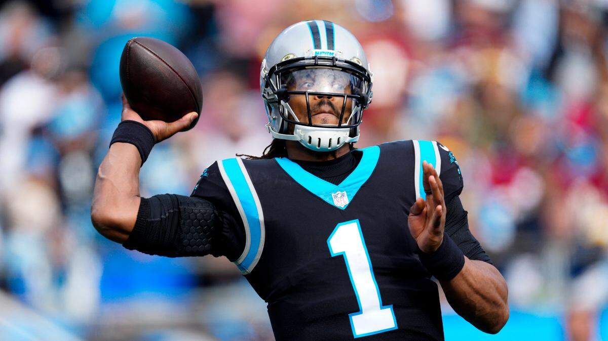 Carolina Panthers quarterback Cam Newton passes against the Washington Football Team during the first half of an NFL football game Sunday, Nov. 21, 2021, in Charlotte, N.C. (AP Photo/Jacob Kupferman)