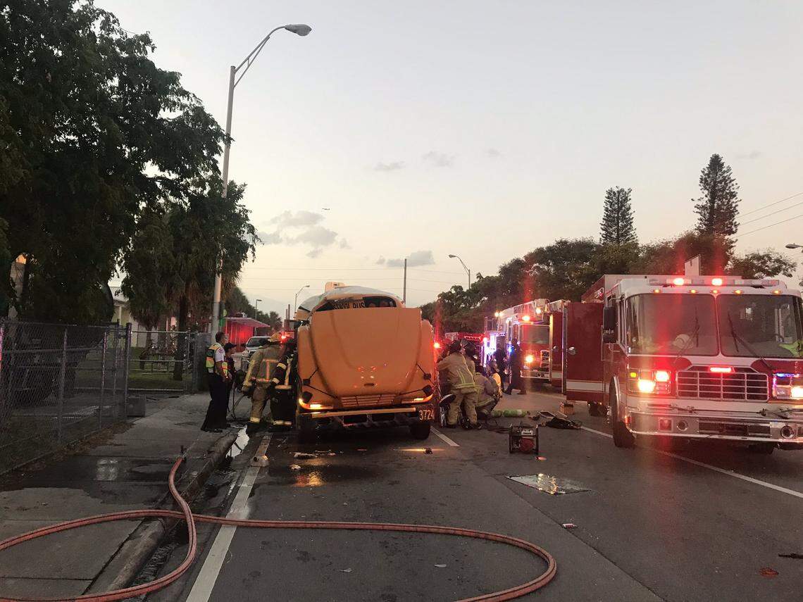 A school bus and a garbage truck collided early Thursday morning in Miami, trapping at least one person on board and setting off a major rescue attempt.