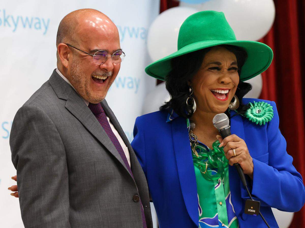 Superintendent Dr. Jose L. Dotres, left, smiles after Congresswoman Frederica Wilson, right, forget to introduce him as “Superintendent” however the two close friends broke into laughter and embraced after the introduction. On Wednesday April 12, 2023 Congresswoman Frederica Wilson and the Boys & Girls Clubs of Miami-Dade Inc announced the Dr. Frederica S. Wilson Club at Dr. Frederica S. Wilson/Skyway Elementary School to bring after school and summer programs to youth in the area.