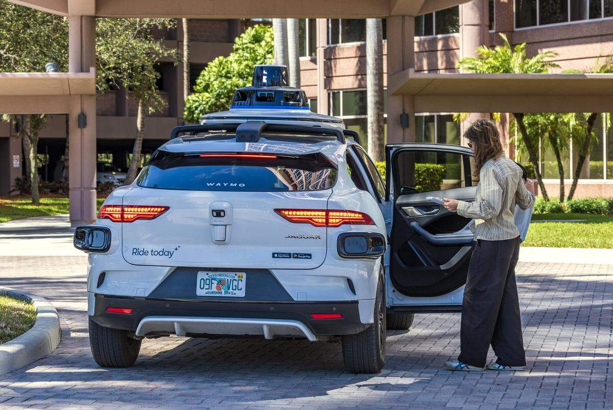 Miami Herald reporter Catherine Odom boards a Waymo self-driving car at the Miami Herald offices near the Miami airport on her way to Brickell on Wednesday, February 25, 2026.
