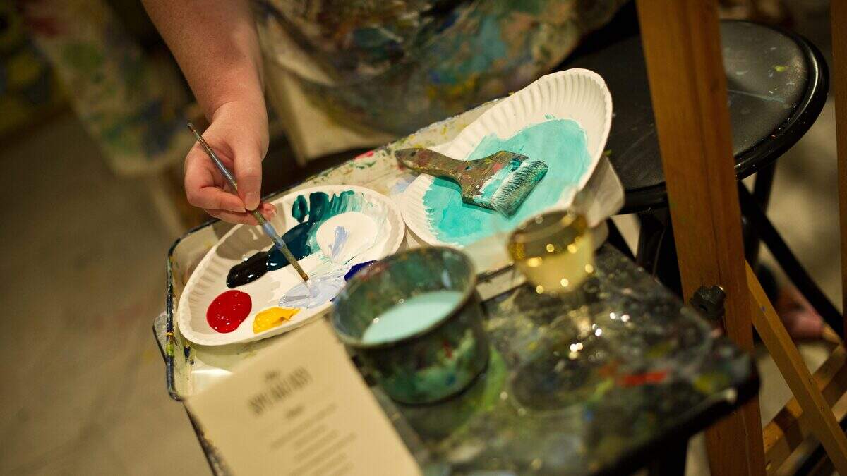 People take part in a “Sippin’ and Paintin’” event at Living Social in Washington on June 26, 2012. Online coupons are last year’s news