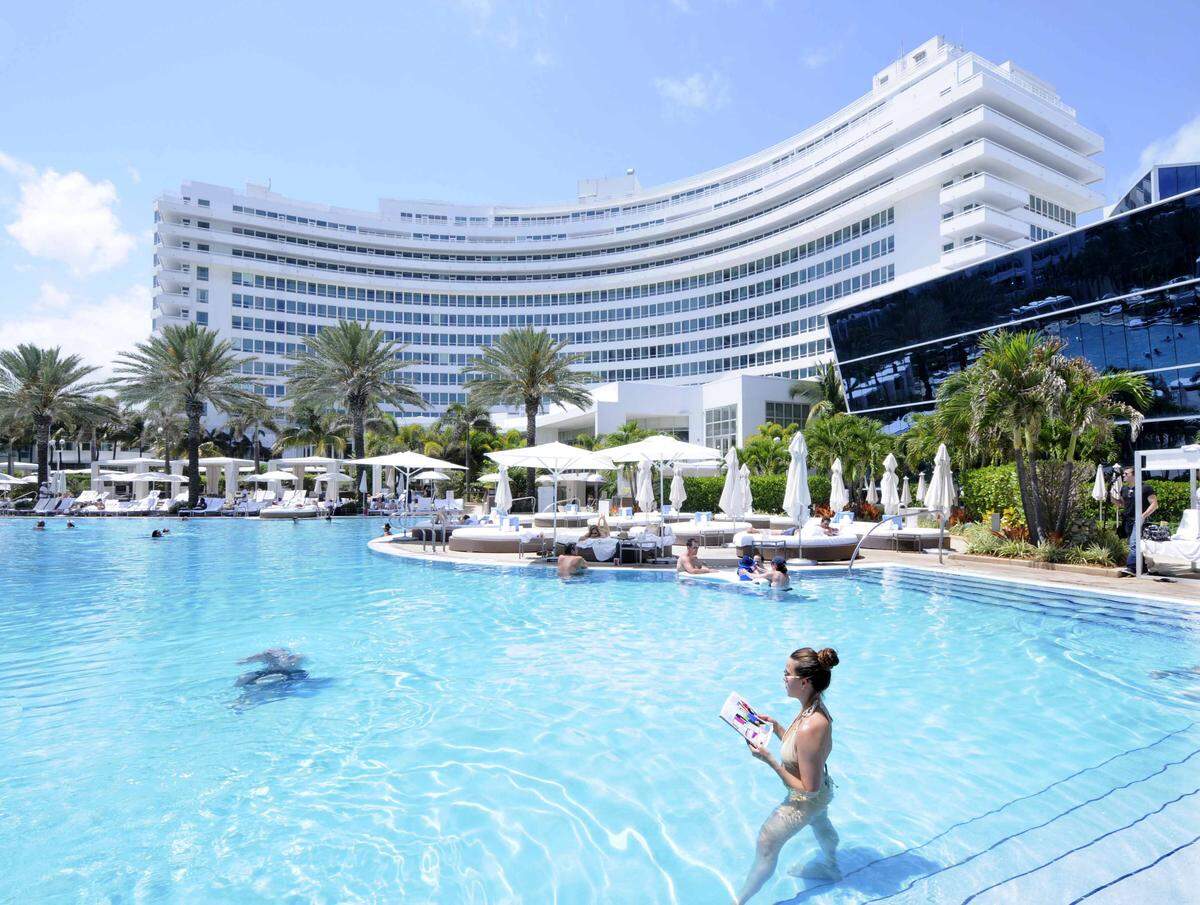 Kathleen Griffith, front, vacationing from New York City, at the Fontainebleau Hotel, that was just named top building in Florida. The AIA, Florida Chapter of the American Institute of Architects, announced the results of their “Florida Architecture: 100 Years. 100 Places,” Wednesday, April 18, 2012, at the Fontainebleau Hotel, which came in number one. More than two million votes were cast by the public during the month-long competition.