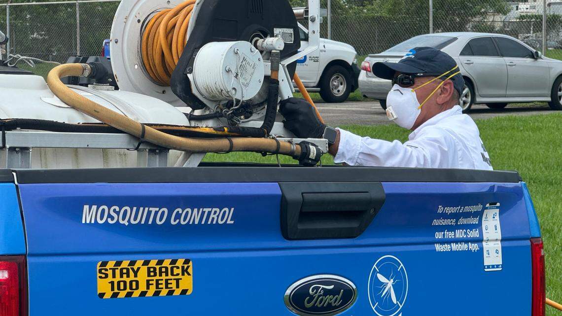 A worker finishes spraying the grass with a pesticide to kill floodwater larvae during a media event at Miami-Dade County’s Mosquito Control unit in Doral, FL on June 17, 2024.
