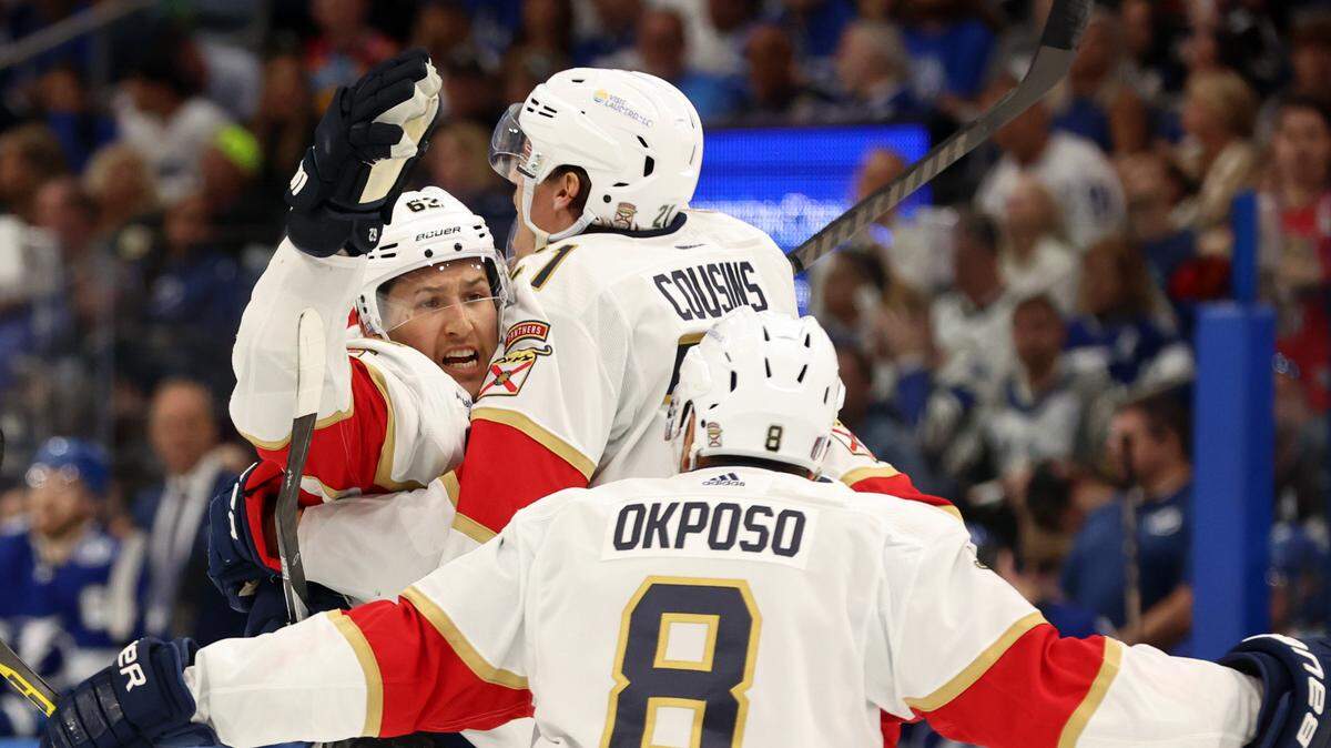 Apr 25, 2024; Tampa, Florida, USA; Florida Panthers defenseman Brandon Montour (62) is congratulated by center Nick Cousins (21), right wing Kyle Okposo (8) and defenseman Oliver Ekman-Larsson (91) after he scored a goal against the Tampa Bay Lightning during the second period in game three of the first round of the 2024 Stanley Cup Playoffs at Amalie Arena.