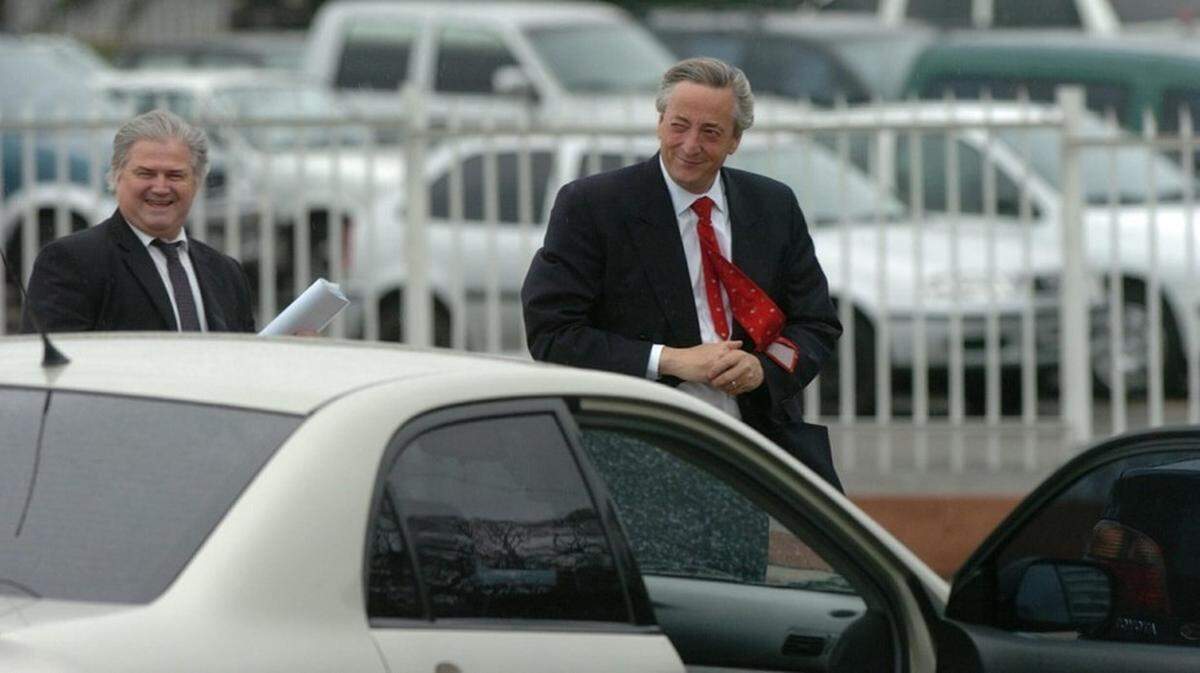 Héctor Daniel Muñoz, left, was a top aide to now deceased Argentine President Néstor Kirchner, right.