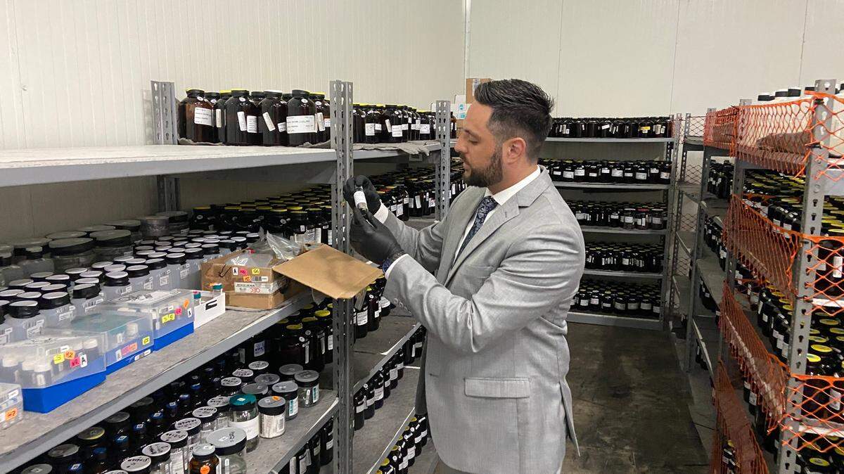 Dylan Boigris, a Coconut Grove trial attorney, inspects samples from the 2010 BP Deepwater Horizon oil spill that are being stored in a South Florida warehouse.