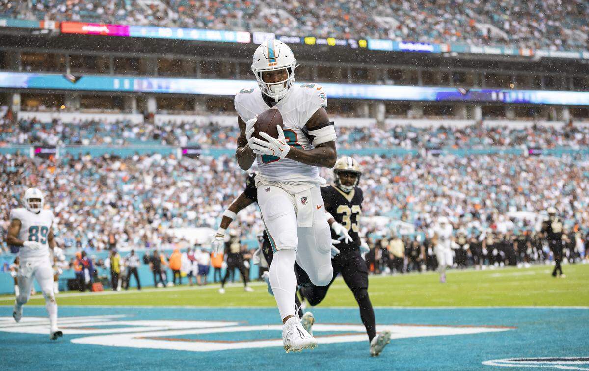 Miami Dolphins tight end Darren Waller (83) catches a pass out of bounds against the New Orleans Saints in the second half of their NFL game at Hard Rock Stadium on Sunday, Nov. 30, 2025, in Miami Gardens, Fla.