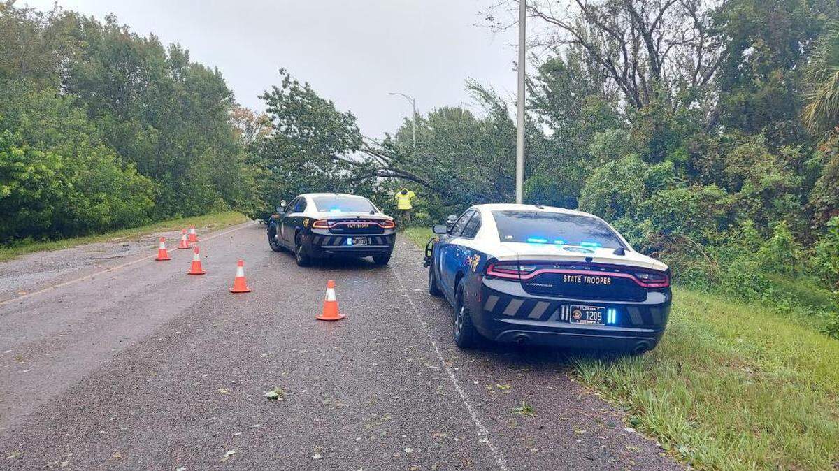 Crews clear storm debris clear a stretch of I-95 in Brevard County.