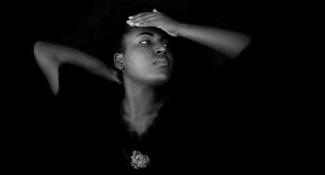 An image of a Black woman as part of an exhibit, Beyond Words: Women of Mother Earth, curated by Miami Herald photographer Carl-Philippe Juste.