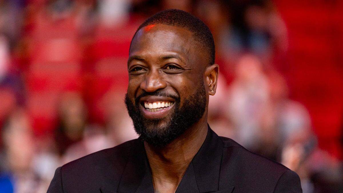 Former Miami Heat player Dwyane Wade reacts during a ceremony honoring his induction into the Naismith Basketball Hall of Fame at Kaseya Center in Miami, Florida, on Sunday, January 14, 2024.