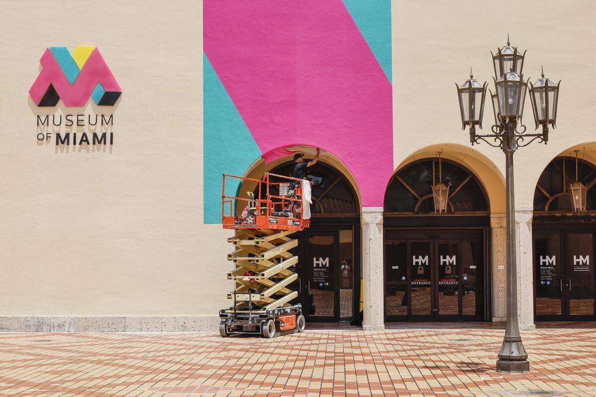 Frank Oliver installs the new logo and display for the Museum of Miami on Wednesday, May 6, 2026. HistoryMiami is changing its name to Museum of Miami and starting a new "museum without walls" initiative where they show exhibitions across Miami Dade County.