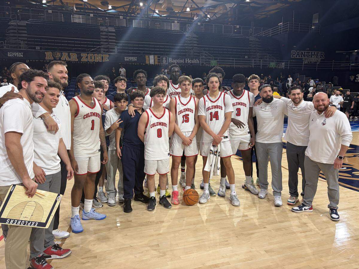 Columbus celebrates its win over Coral Glades on Saturday in the Region 4-7A boys’ basketball final at FIU’s Ocean Bank Convocation Center.