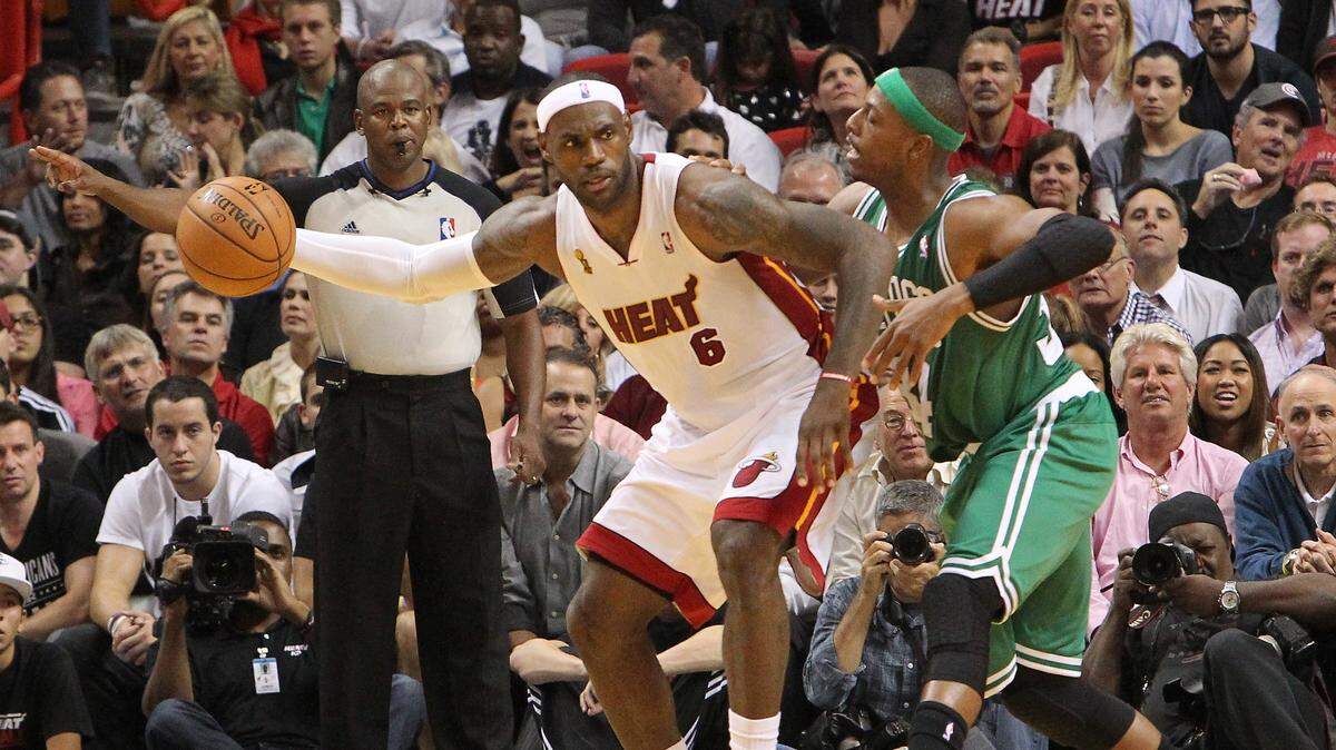 LeBron James drives against Paul Pierce during the second quarter of the 2012-13 NBA season opener game between the Boston Celtics against Miami Heat at the AmericanAirlines Arena in Miami on Tuesday, October 30, 2012.