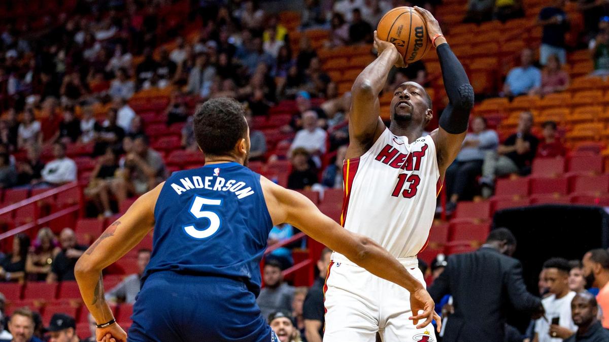 Miami Heat center Bam Adebayo (13) shoots the ball over Minnesota Timberwolves defender Kyle Anderson (5) during the first half of an NBA preseason basketball game at FTX Arena in Miami, Florida, on Tuesday, October 4, 2022.