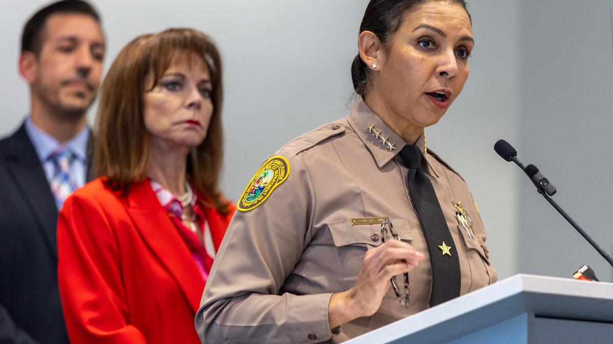 Sheriff Rosie Cordero-Stutz, right, speaks to the media during a press conference at the Miami-Dade Sheriff’s Office HQ in Doral, Florida, on Wednesday, March 12, 2025. The Sheriff disclosed details of a public corruption investigation that resulted in arrests of two health inspectors on public corruption charges.