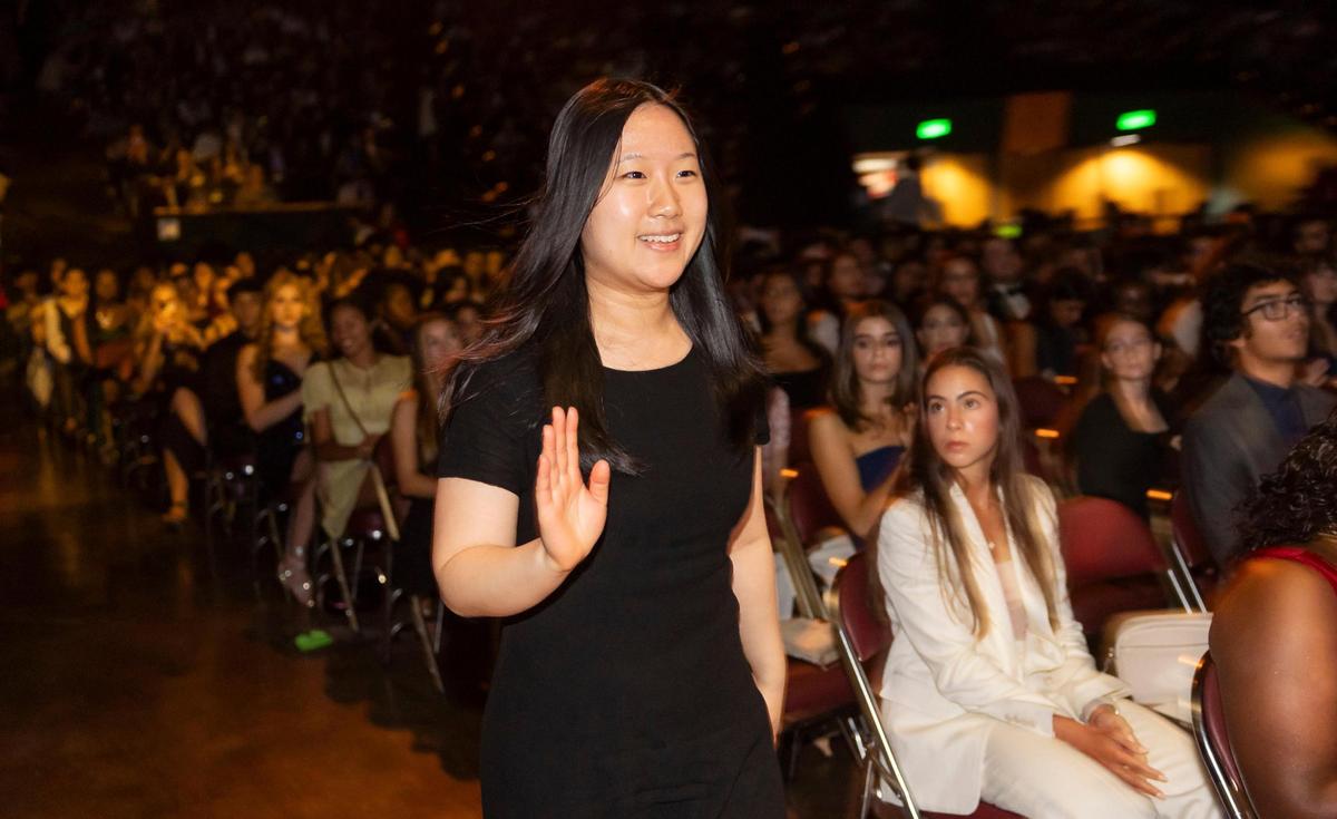 Silver Knight winner Amy Zhou, from School for Advanced Studies Wolfson, walks to the stage after winning in the English & Literature category during the Miami Herald & el Nuevo Herald 67th Silver Knight Award Ceremony at the James L.&nbsp;Knight&nbsp;Center on Wednesday, May 14, 2025, in downtown Miami, Fla.