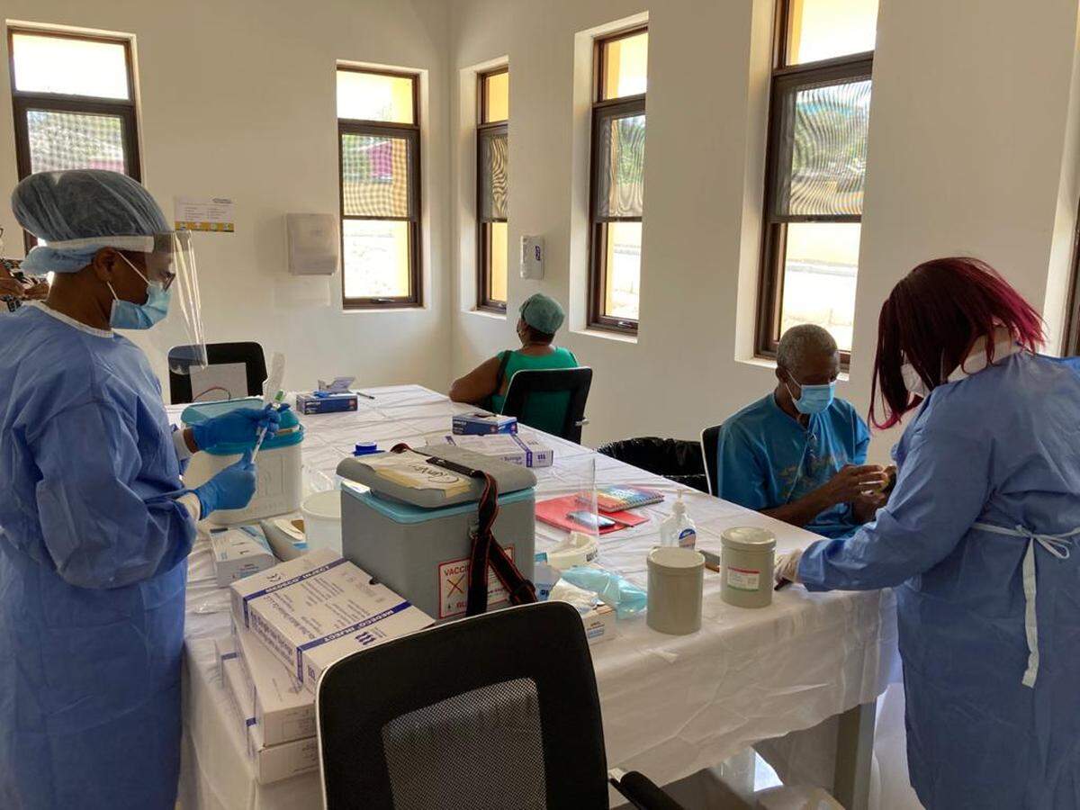 After receiving 40,000 doses of COVID-19 vaccine from the government of India in early March, Antigua and Barbuda is trying to vaccinate as many nationals as possible. Lionel Walker, sitting down, waits to get the first of two shots on Thursday, March 4, 2021, at the Glanvilles Polyclinic.
