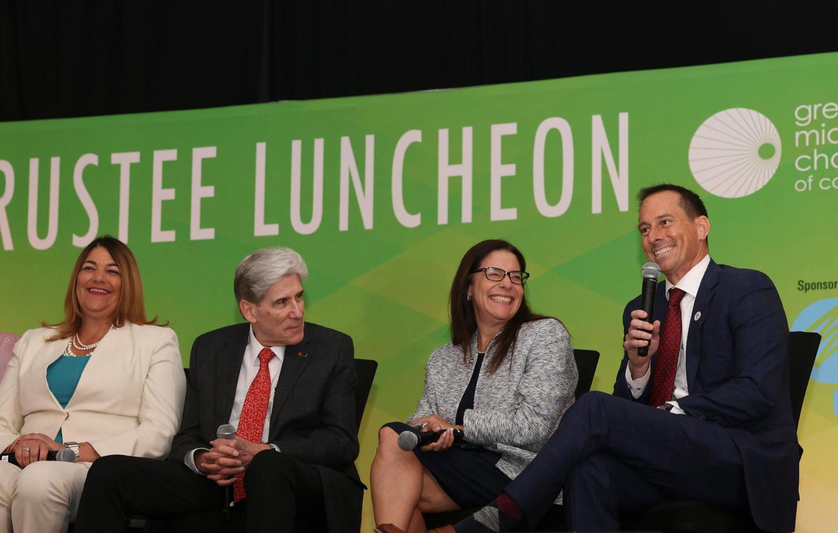 Mike Allen, president of Barry University, right, talks while, from left to right, Madeline Pumariega, president of Miami Dade College, Julio Frenk, president of the University of Miami, and Elizabeth Béjar, provost of Florida International University, laugh at his joke. The South Florida university and college leaders talked about adjusting to a post-pandemic world on Wednesday, April 5, 2023, at the Jungle Island Bloom Ballroom.