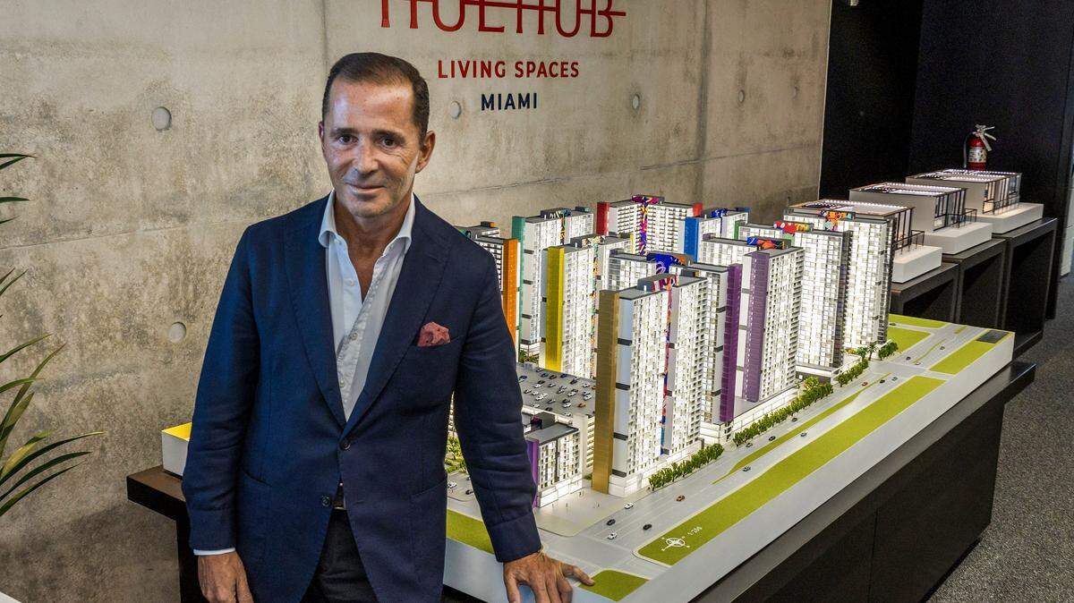 Spanish real estate developer Pablo Castro, posed next to the scale model of The HueHub, an $880 million mixed-use development he is planning to built in Miami's West Little River district, on Thursday, September 11, 2025. 