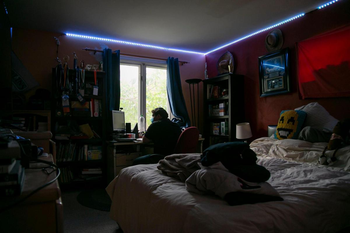 Salomon Assouline, 17, an 11th-grader at Dr. Michael M. Krop Senior High School, studies after school at his home in Miami on Monday, March 9, 2021.