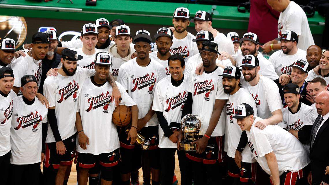 Members of the Miami Heat pose for pictures after the Heat defeated the Boston Celtics 103-84 in Game 7 of the NBA basketball Eastern Conference finals Monday, May 29, 2023, in Boston. (AP Photo/Michael Dwyer)