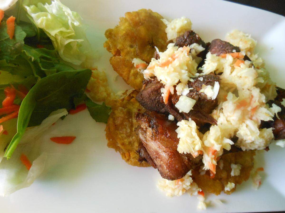 Griot with pikliz at Yardie Spice in Homestead.