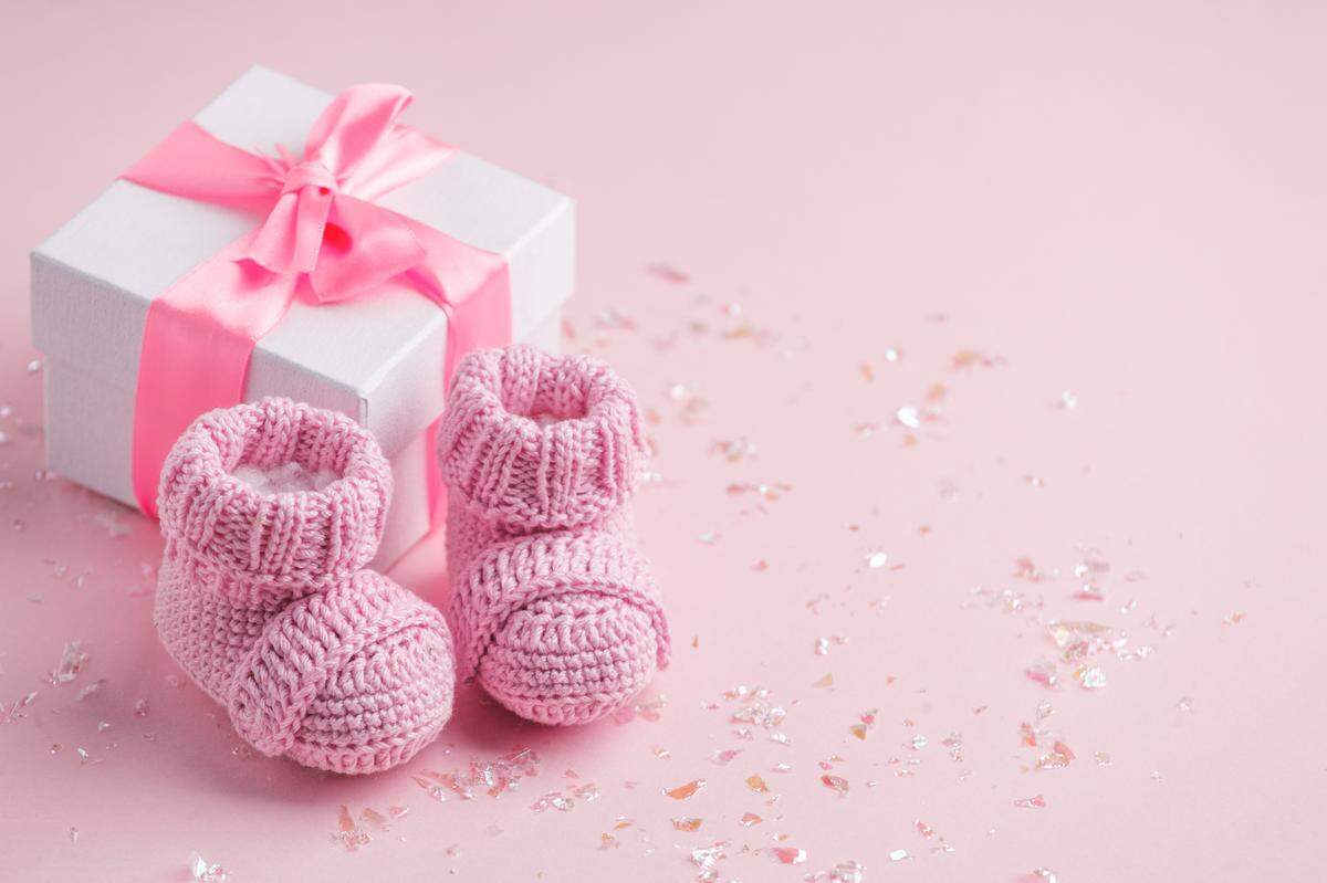 pair of pink knitted baby shoes