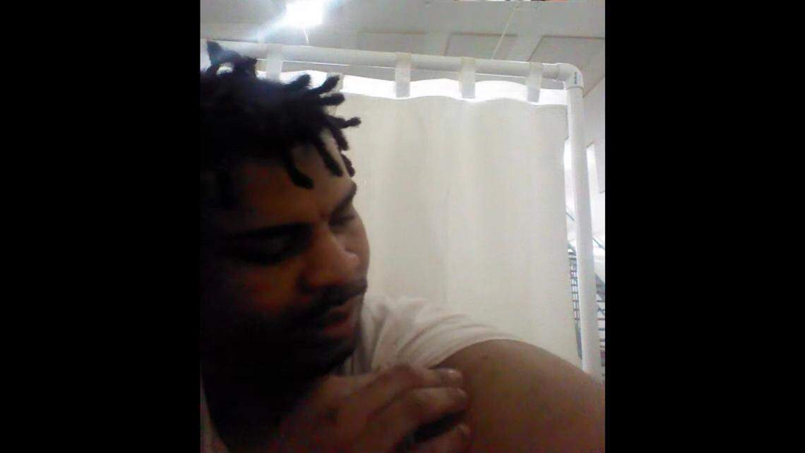 Glades County ICE detainee Duan Dixon shows the arm in which he received the COVID-19 vaccine.