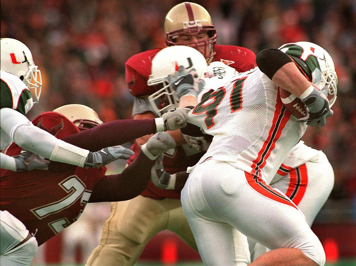 Chestnut Hill, MA - 11/10/01 -Boston Globe Staff Photo: Barry Chin. BC’s Mark Parenteau makes a last ditch grab but gets only jersey as Miami’s Matt Walters pulls in a tipped pass from BC QB Brian St. Pierre on the way to running it back for a last minute TD stopping BC’s chance of a miraculous win over #1 ranked Miami at home today.