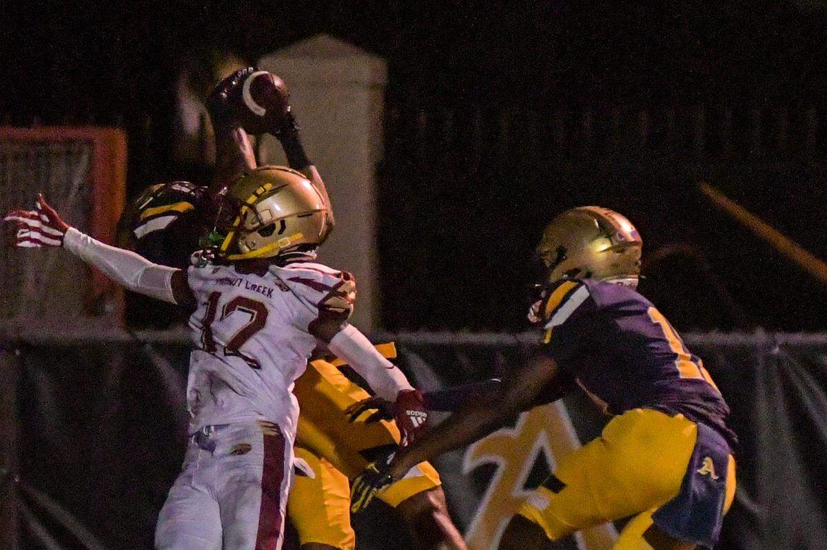St. Thomas Aquinas wide receiver Jaylen Bonelli catches a touchdown pass in a Region 3-3M quarterfinal game against Coconut Creek on Friday, Nov. 11, 2022, at St. Thomas Aquinas High School in Fort Lauderdale, Florida.