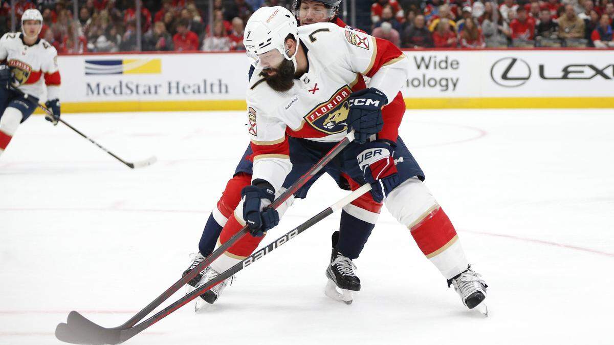 Apr 8, 2023; Washington, District of Columbia, USA; Florida Panthers defenseman Radko Gudas (7) skates with the puck as Washington Capitals center Craig Smith (16) defends during the first period at Capital One Arena. Mandatory Credit: Amber Searls-USA TODAY Sports