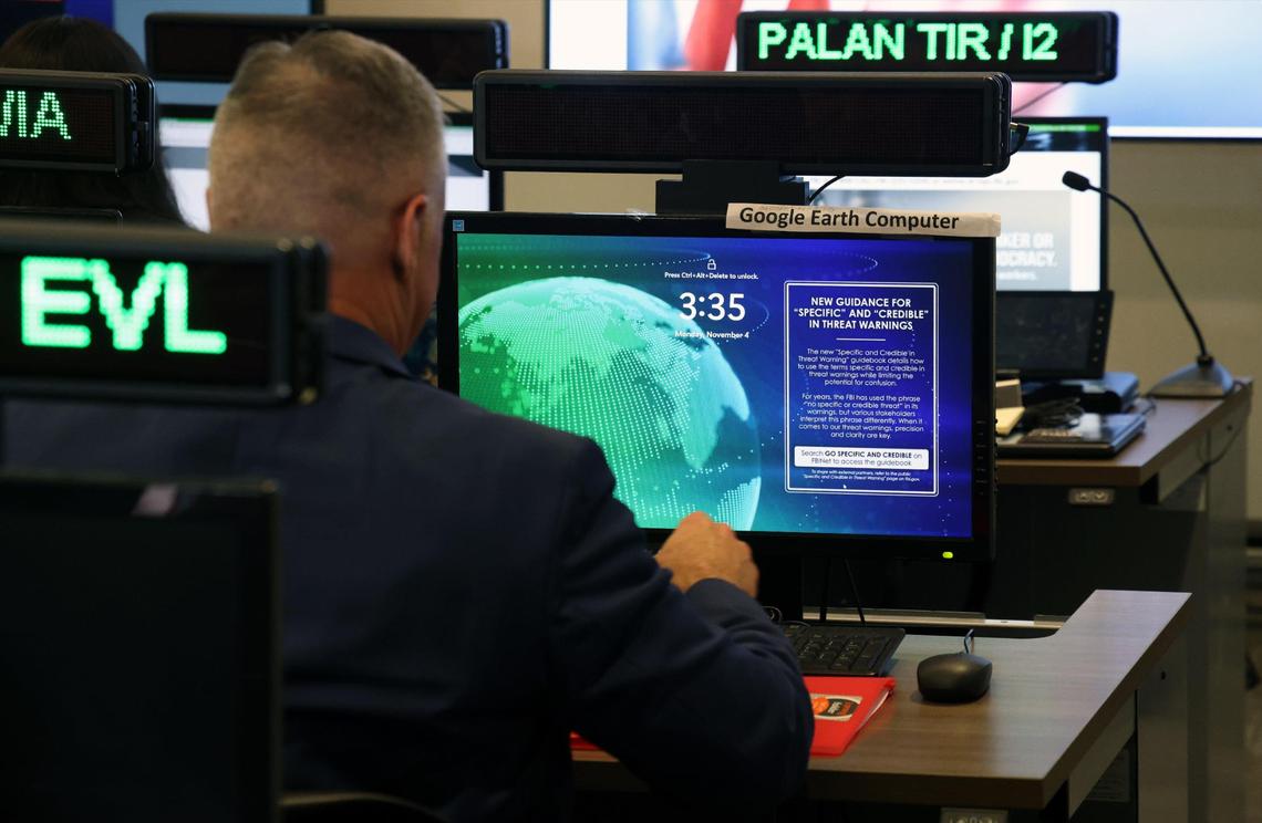 Members of the Election Threats Task Force, a partnership between the Department of Justice and the FBI, operate in the Election Crime Command Post at the FBI Miami Field Office in Miramar, Florida, on Monday, Nov. 4, 2024.