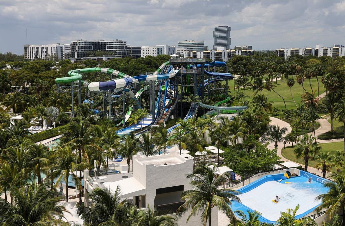 The five-acre Tidal Cove waterpark is viewed from the Presidential Suite as visitors and hotel guests enjoy the waterslide, cabanas, pools, and lazy river on Thursday, August 15, 2024, in Aventura, Florida.