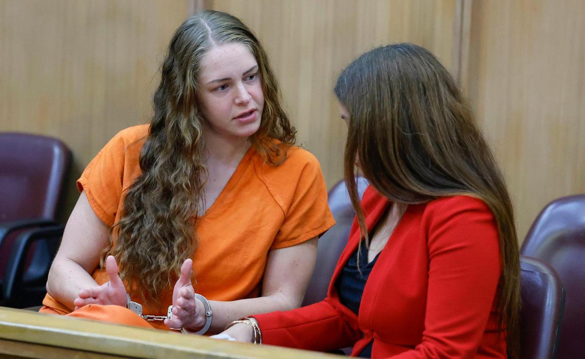 Defendant Courtney Clenney, Miami OnlyFans model accused of murdering boyfriend, speaks to attorney Sabrina Vora-Puglisi at Miami-Dade Circuit Court Judge Laura Sheron Cruz, courtroom at the Miami-Dade County Courthouse in Miami, Florida, on Thursday, December 19, 2024. Attorneys Sabrina Vora-Puglisi Frank Prieto