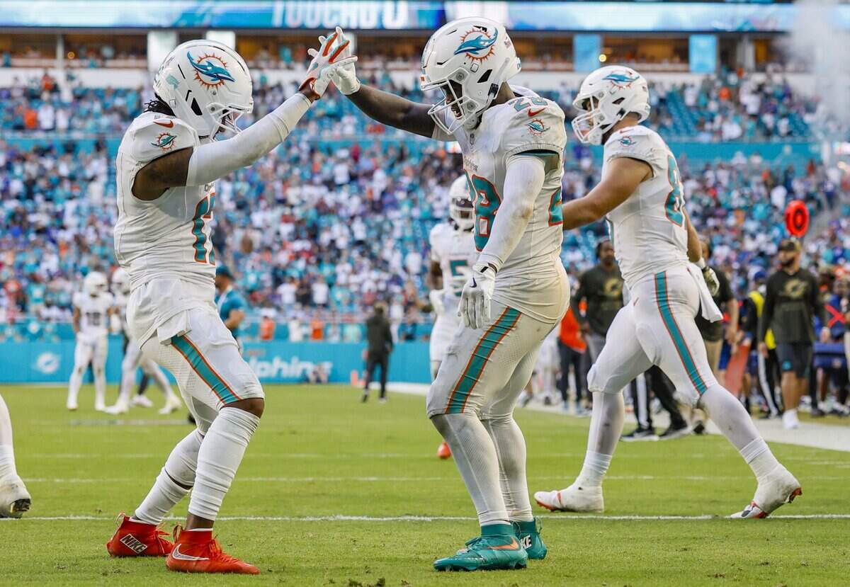 Miami Dolphins running back De'Von Achane (28) ceelbrates his touchdown while dancing in the endzone with Miami Dolphins wide receiver Jaylen Waddle (17) during the second half of an NFL football game at Hard Rock Stadium in Miami Gardens, Florida on Sunday, November 9, 2025.
